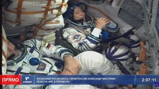 Japanese billionaire Yusaku Maezawa tucked inside Russia's Soyuz spacecraft heading for a nearly two-week trip at the International Space Station.