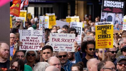 Protesters angry at rising bills and food prices gather in London on 1 October 2022