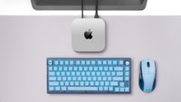 Corsair M75 mouse and K65 plus mouse, alongside a Mac mini