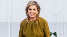 Queen Maxima, wearing a moss green outfit, attends INSEAD Alumni Forum 'Lead with Integrity, Shape the Future Now!' a