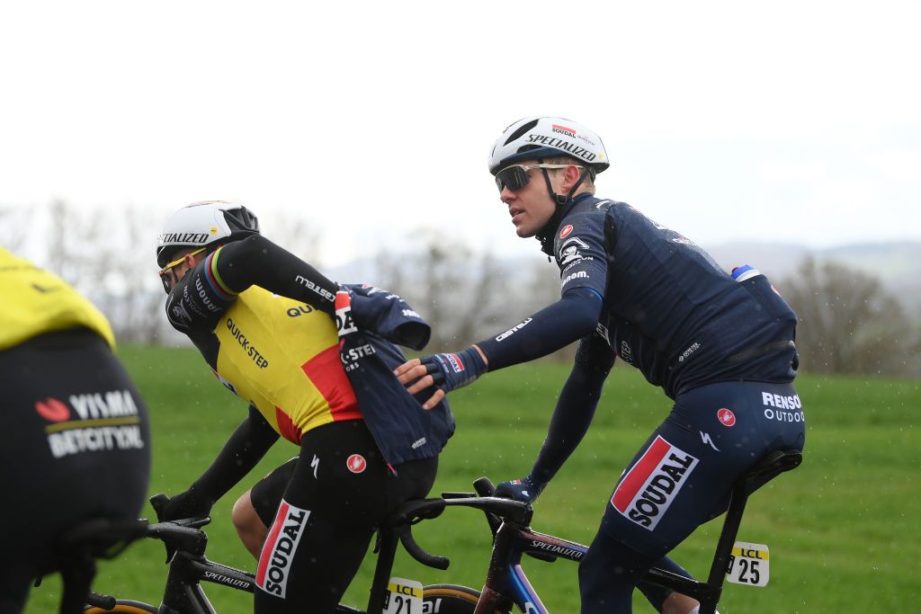 MONT BROUILLY FRANCE MARCH 06 LR Remco Evenepoel of Belgium helped by Casper Pedersen of Denmark and Team Soudal Quick Step during the 82nd Paris Nice 2024 Stage 4 a 183km stage from ChalonsurSane to Mont Brouilly 476m UCIWT on March 06 2024 in Mont Brouilly France Photo by Alex BroadwayGetty Images