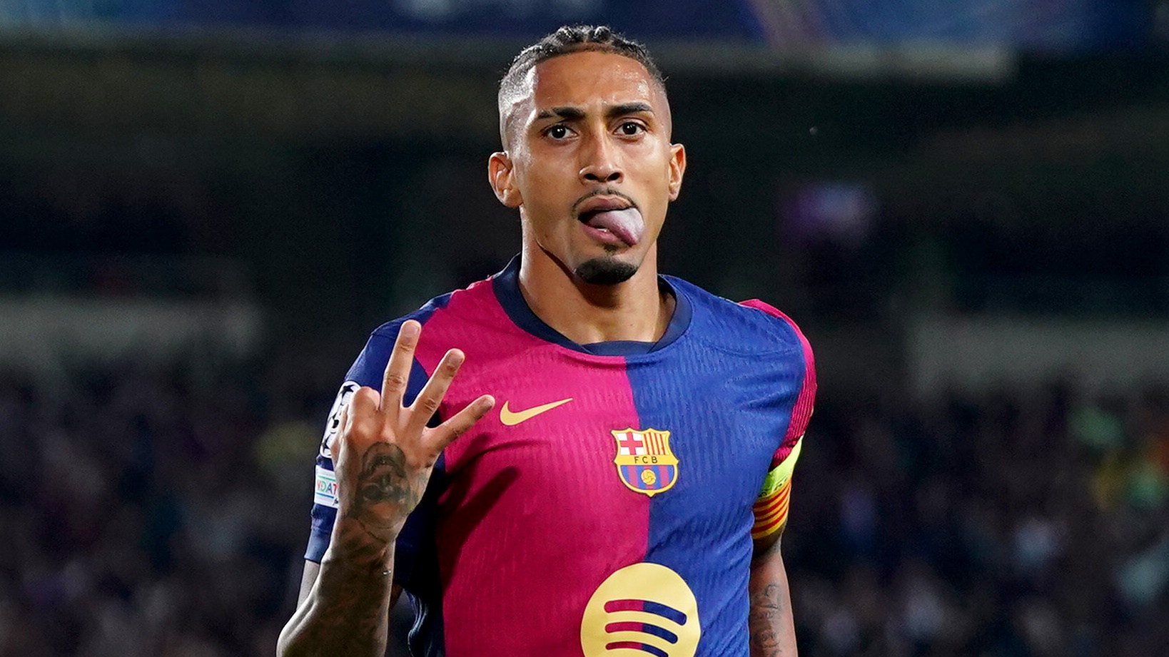 Raphinha of FC Barcelona celebrates scoring his team&#039;s fourth goal and his hat-trick goal during the UEFA Champions League 2024/25 League Phase MD3 match between FC Barcelona and FC Bayern Munchen at Estadi Olimpic Lluis Companys on October 23, 2024 in Barcelona, Spain. 