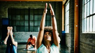 7 Types of yoga: Image shows woman doing yoga pose