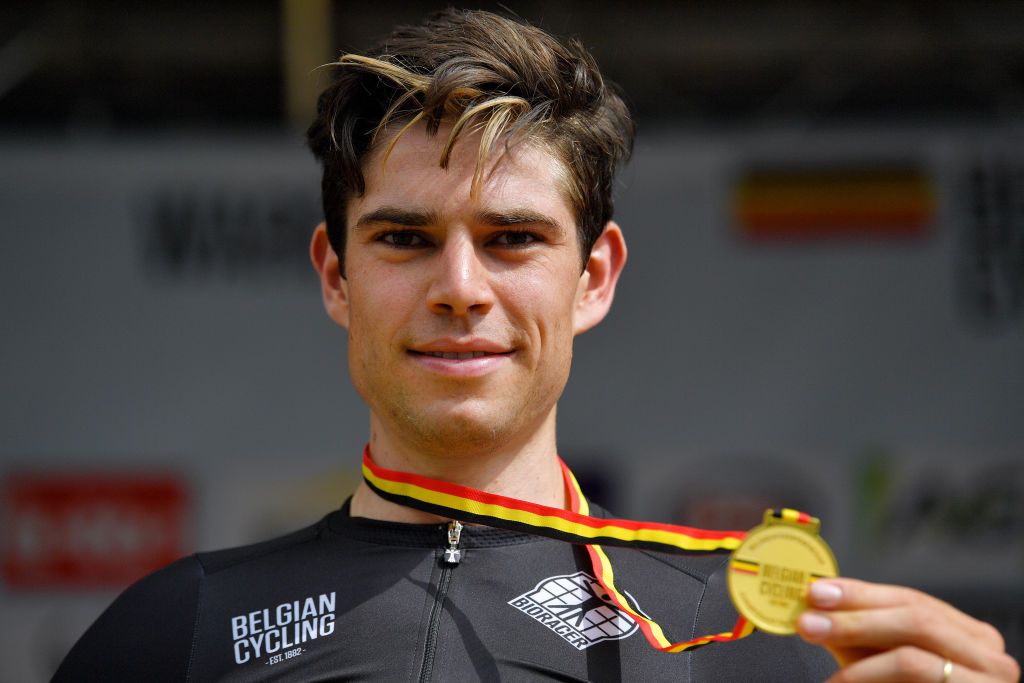 WAREGEM BELGIUM JUNE 20 Wout Van Aert of Belgium Gold Medal Belgian Champion Jersey celebrates at podium during the 122th Belgian Road Championship 2021 Mens Road Race a 2213km one day race from Waregem to Waregem BELCycling belgiancycling on June 20 2021 in Waregem Belgium Photo by Luc ClaessenGetty Images