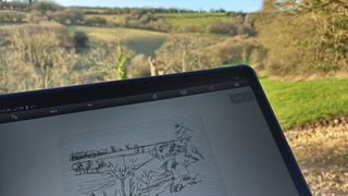 XPPen Magic Drawing Pad; a digital sketch on a tablet being held in a field
