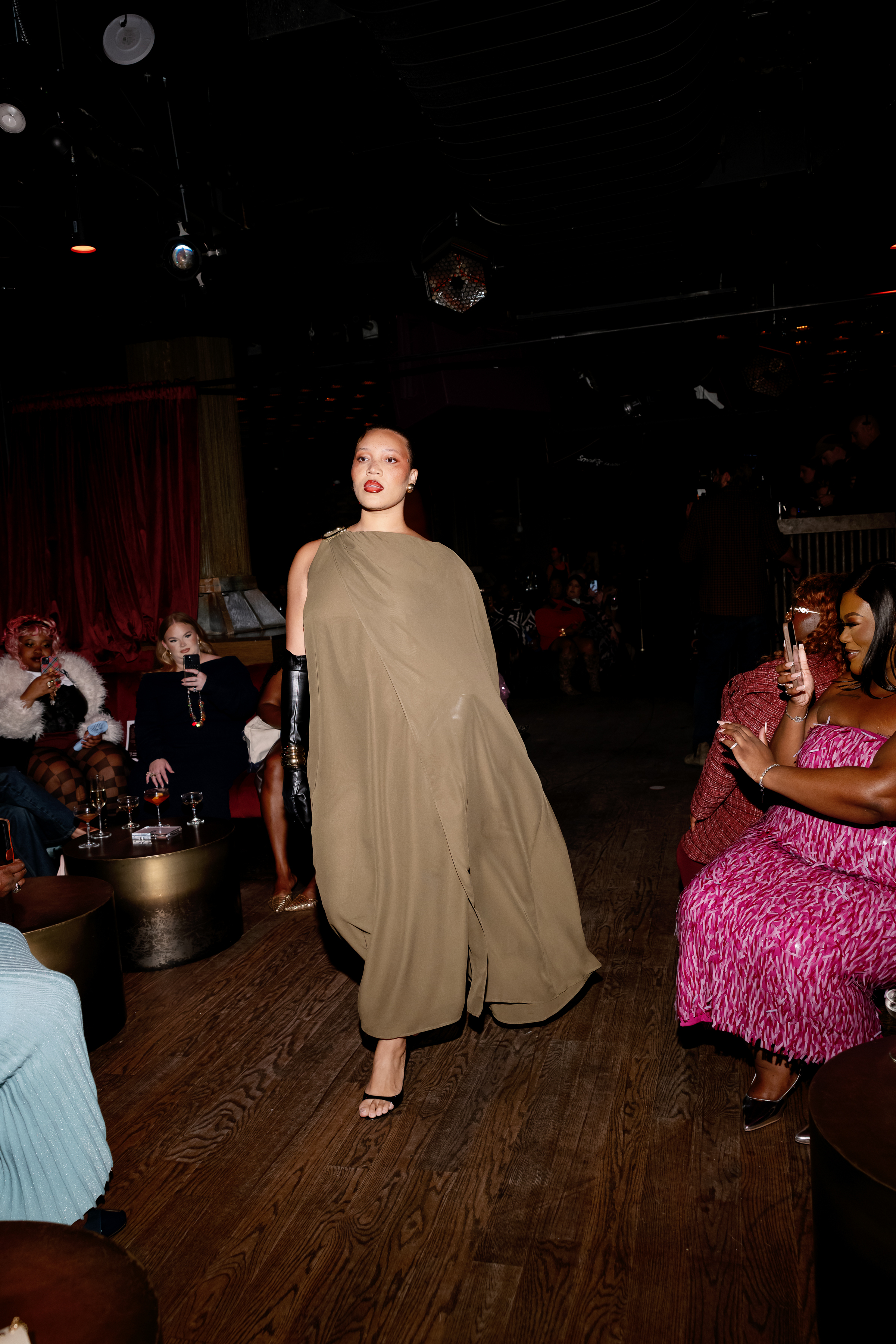 Eloquii model walking in runway for brand&#039;s show.