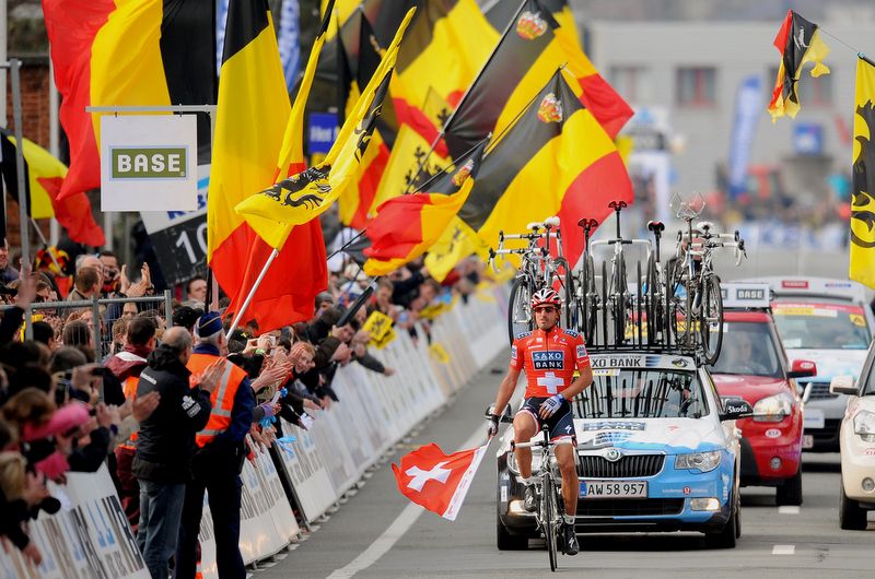 Fabian Cancellara had time to grab a Swiss flag from a fan in the finishing straight