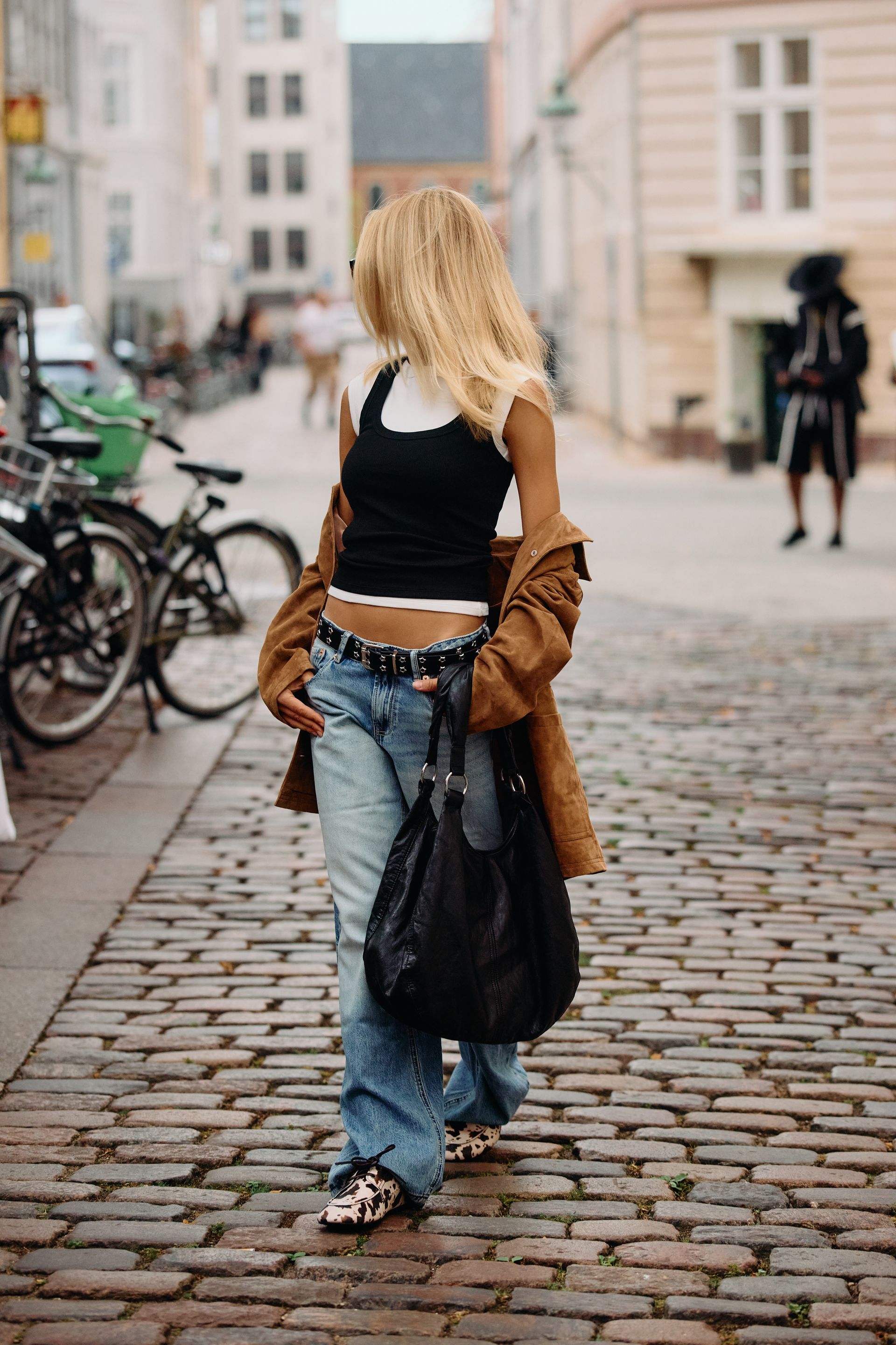 Copenhagen Fashion Week attendees wear animal print shoes.