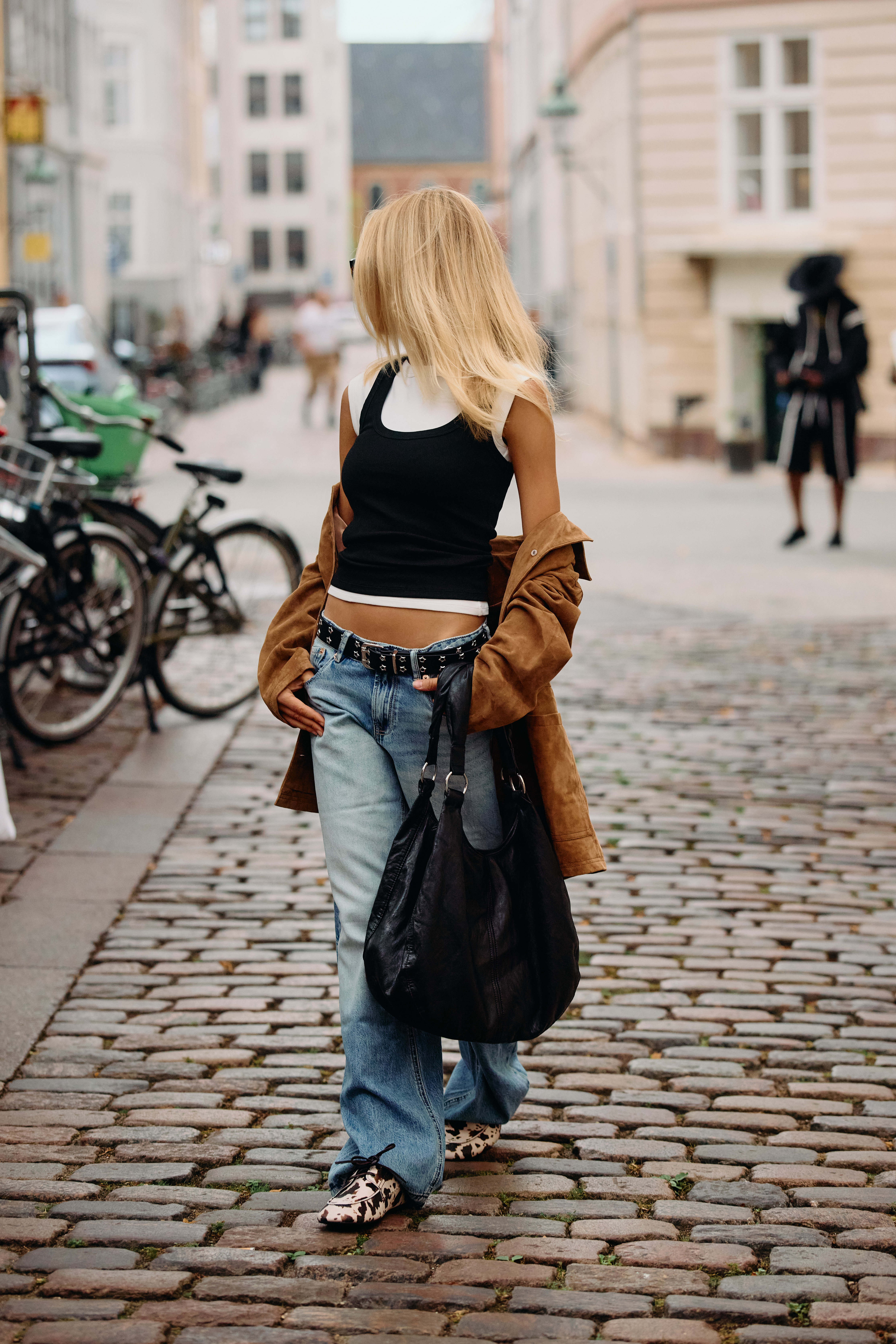 Copenhagen Fashion Week attendees wear animal print shoes.
