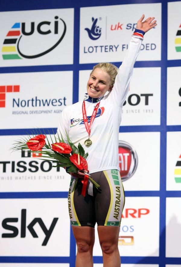 Belinda Goss (Australia) waves from the top of the women's scratch race podium.