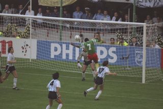 François Omam-Biyik heads Cameroon into the lead against Argentina in the 1990 World Cup's opening game.