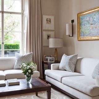 seating room with cream wall and white sofa