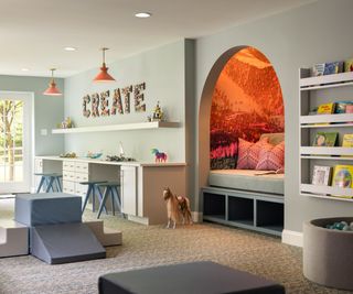 Play room with pale blue walls and a reading alcove