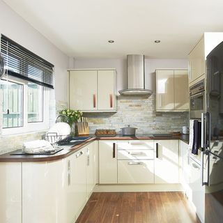 kitchen with wooden flooring and cream wall