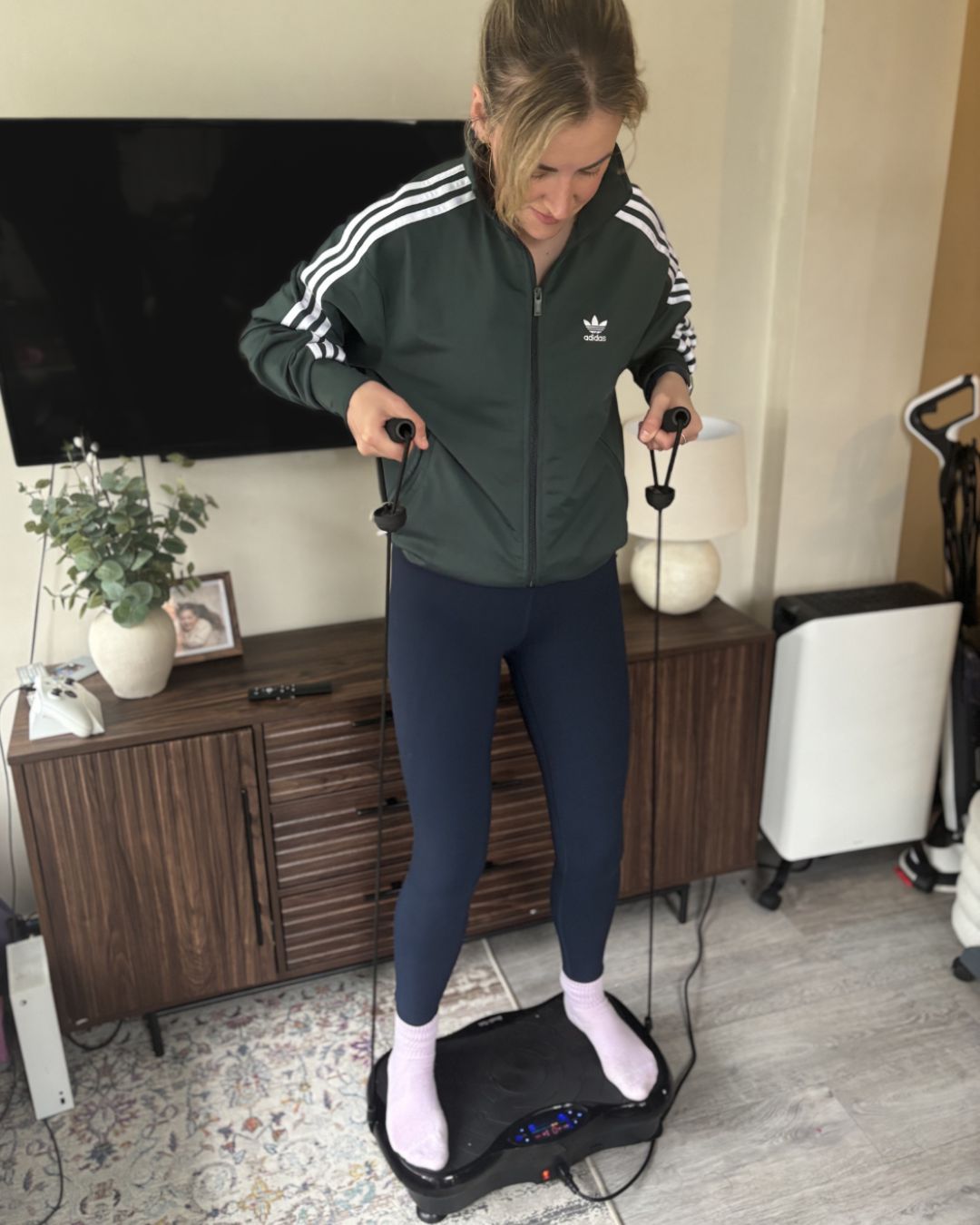 Health freelancer Rebecca Lawton trying a vibration plate at home
