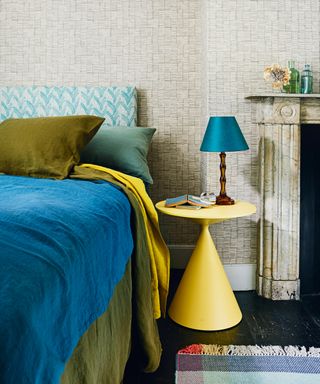 blue green and yellow decor in neutral bedroom