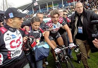 Fabian Cancellara (CSC) surrounded by CSC staff after his 2006 victory