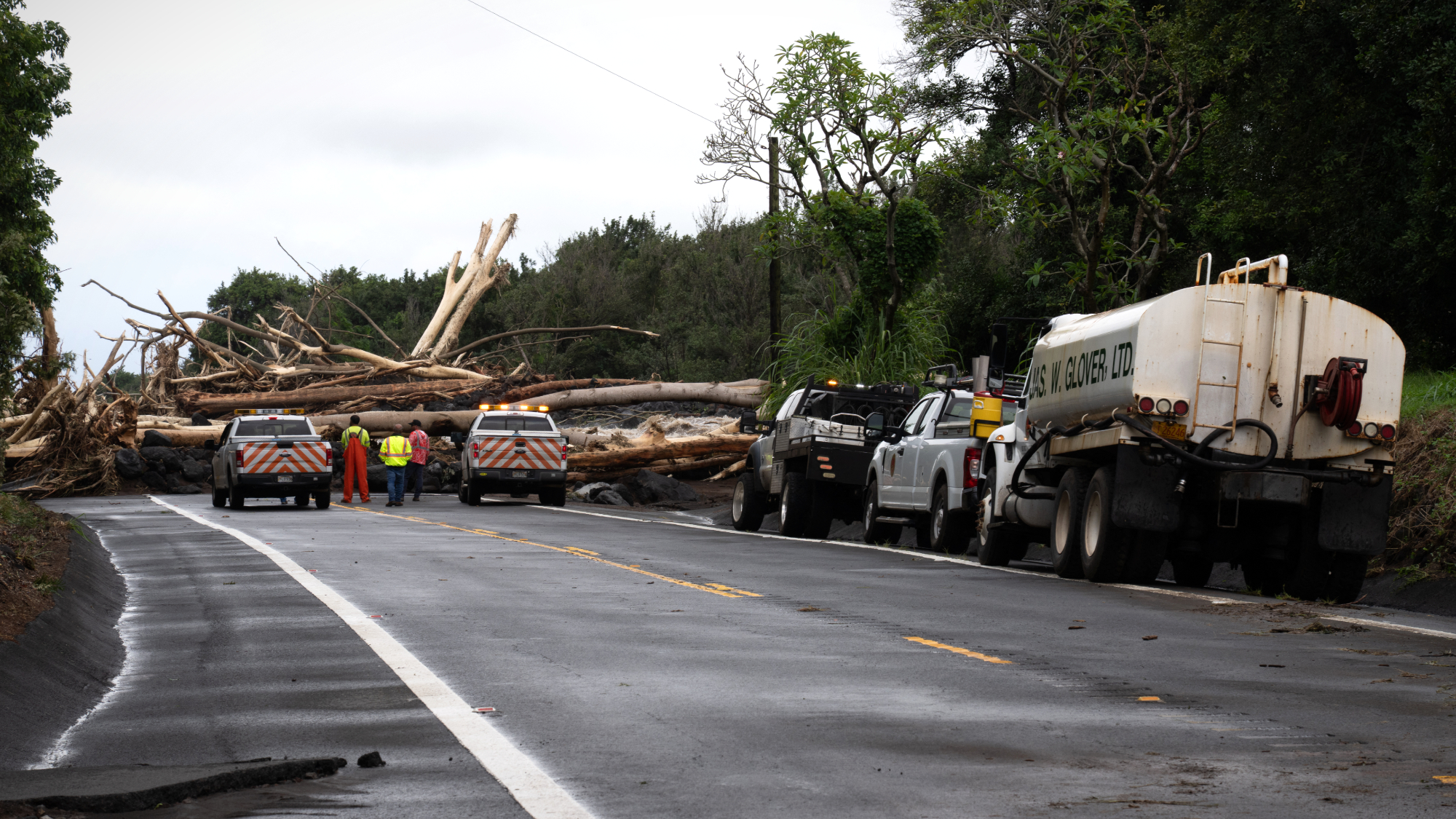 Hawaii Department of Transportation workers inspect road damage caused by Hurricane Lala in Pahala, Hawaii