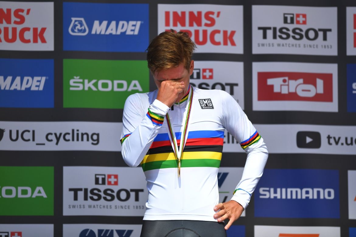 The emotion gets to Evenepoel on the podium