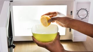Cleaning microwave with a lemon