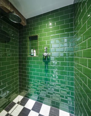 dark green metro tiles in shower enclosure