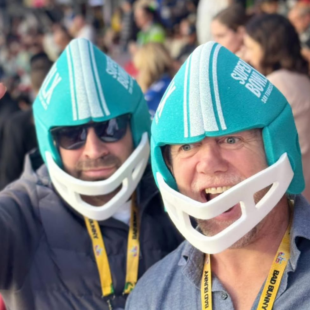 Mike Tindall and friend wearing blue helmets at the Super Bowl