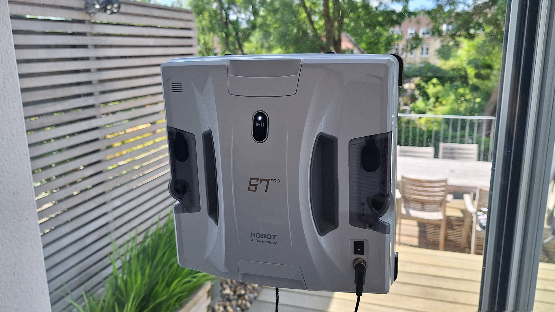 Hobot S7 Pro window cleaning robot on inside of reviewer&#039;s patio door window
