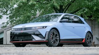 2025 Hyundai Ioniq 5 N AWD parked in an urban space in front of a tree