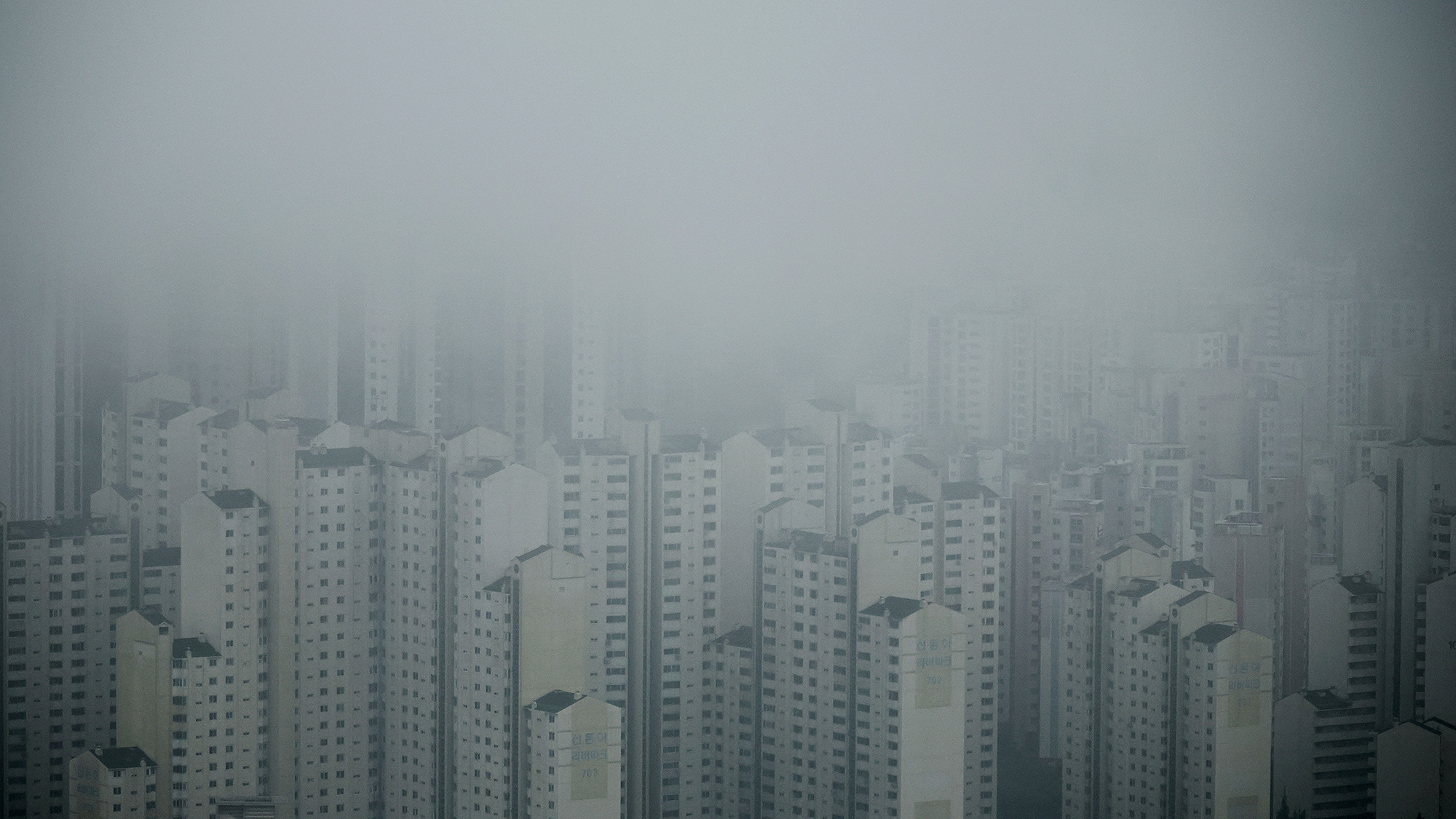 Apartment complexes are shrouded in rain clouds in Seoul, South Korea