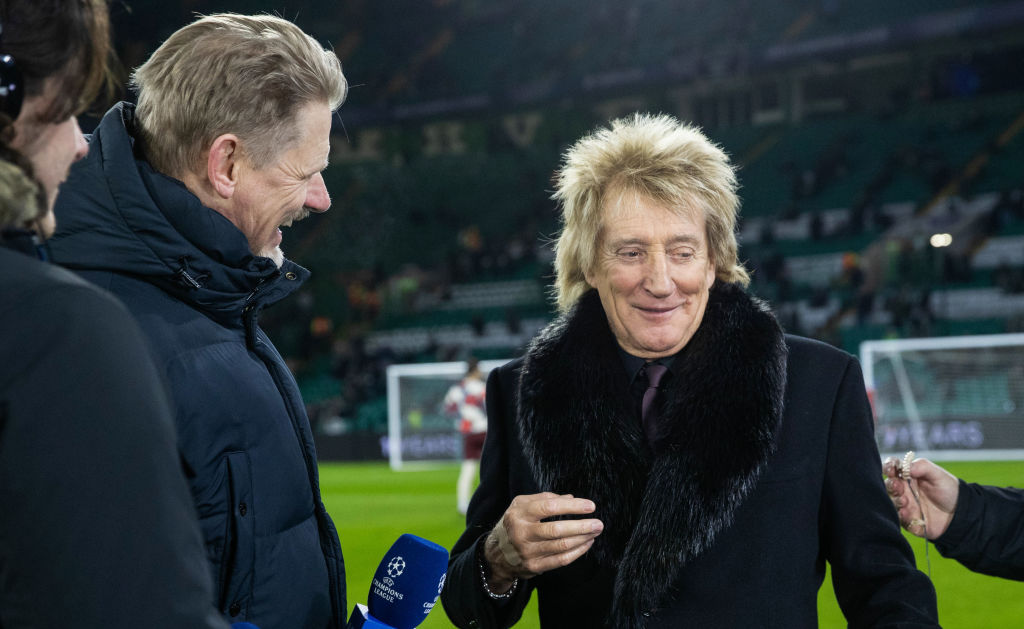 Sir Rod Stewart speaks to Peter Schmeichel during the UEFA Champions League 2024/25 League Knockout Play-off first leg match between Celtic and FC Bayern Munich at Celtic Park, on February 12, 2025, in Glasgow, Scotland