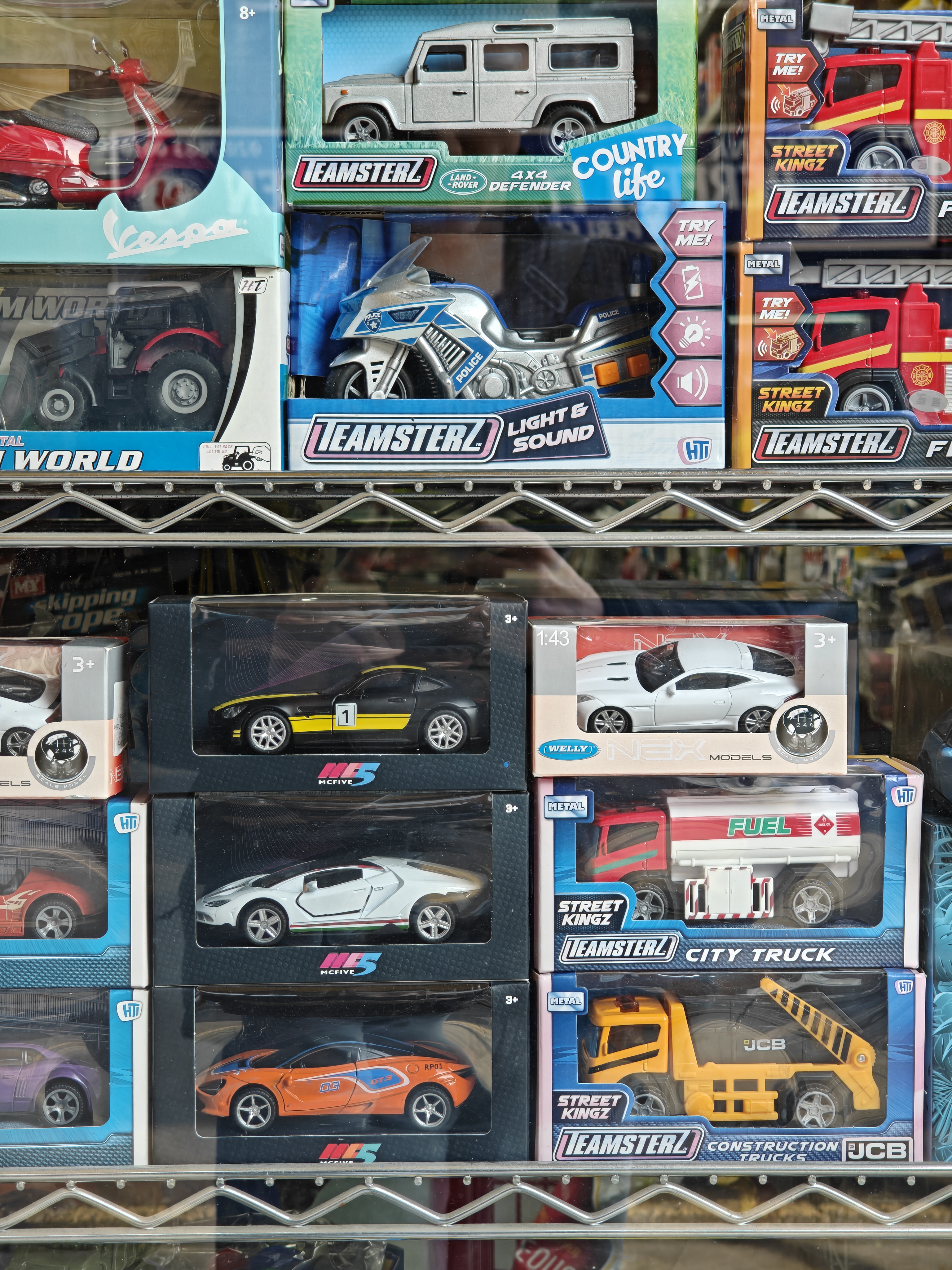 A selection of toy cars in a sotre window