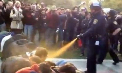 A California cop pepper sprays peaceful protesters at the University of California, Davis