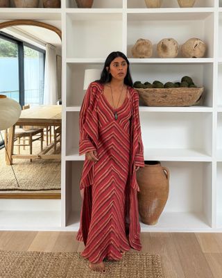 @monikh wearing a chevron printed maxi dress and pendant necklace