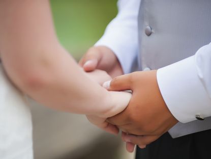 Wedding couple man and woman holding hands