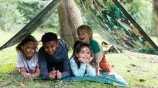 garden activities for kids: the den kit cover with four kids