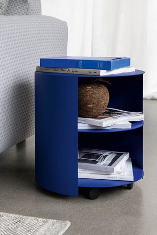 Blue bedside table with books