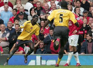 Emmanuel Adebayor (left) scored the last time Arsenal won at Old Trafford