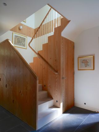 Wooden staircase at Danish mews house