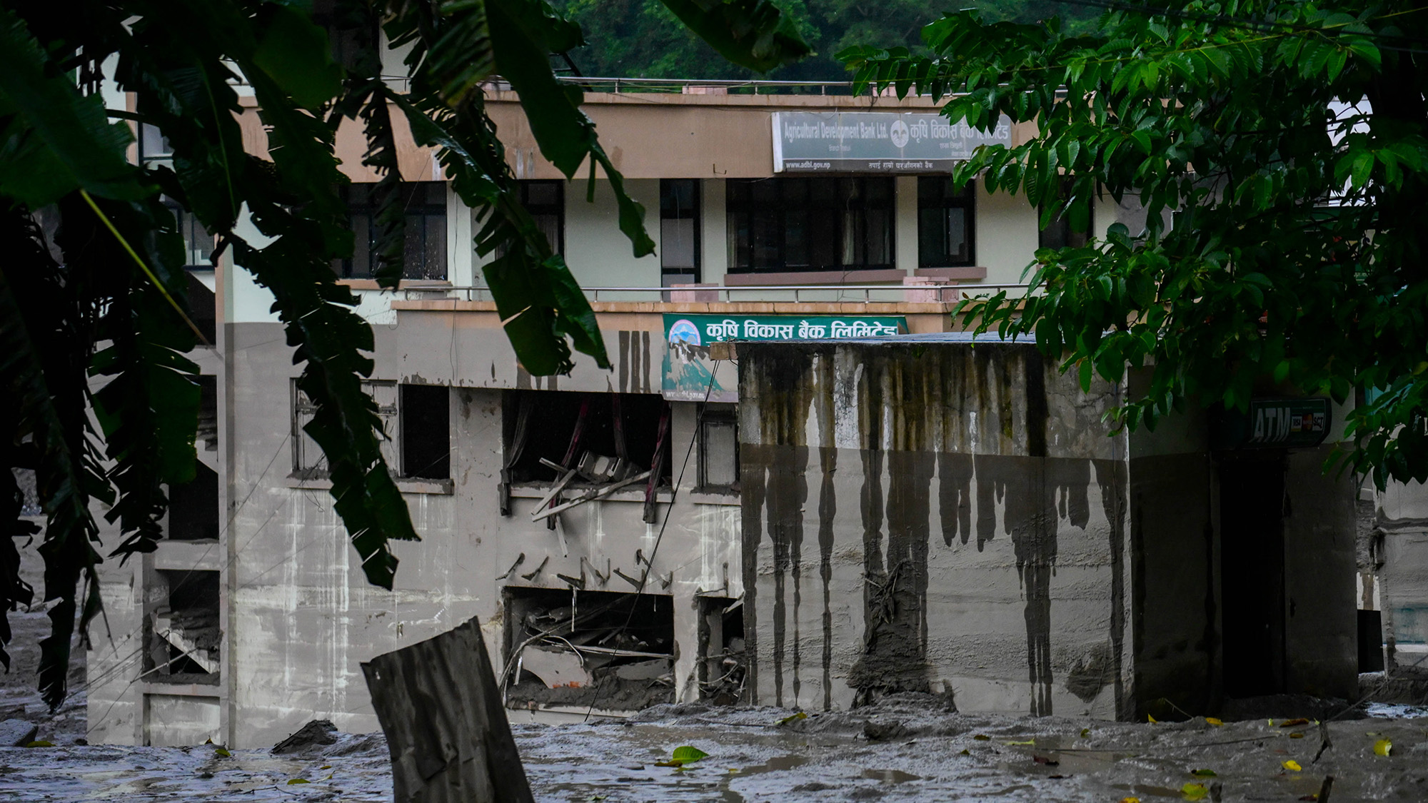 Waters rise around a building