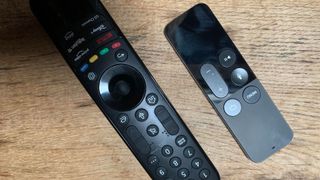 The LG G3 OLED TV remote beside the Apple TV remote