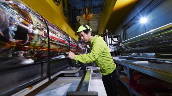  Makoto Fujiwara stands in front of ALPHA Experiment apparatus at CERN in Switzerland.