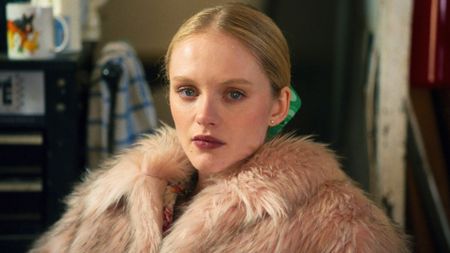 Emma Laird stares at something off camera