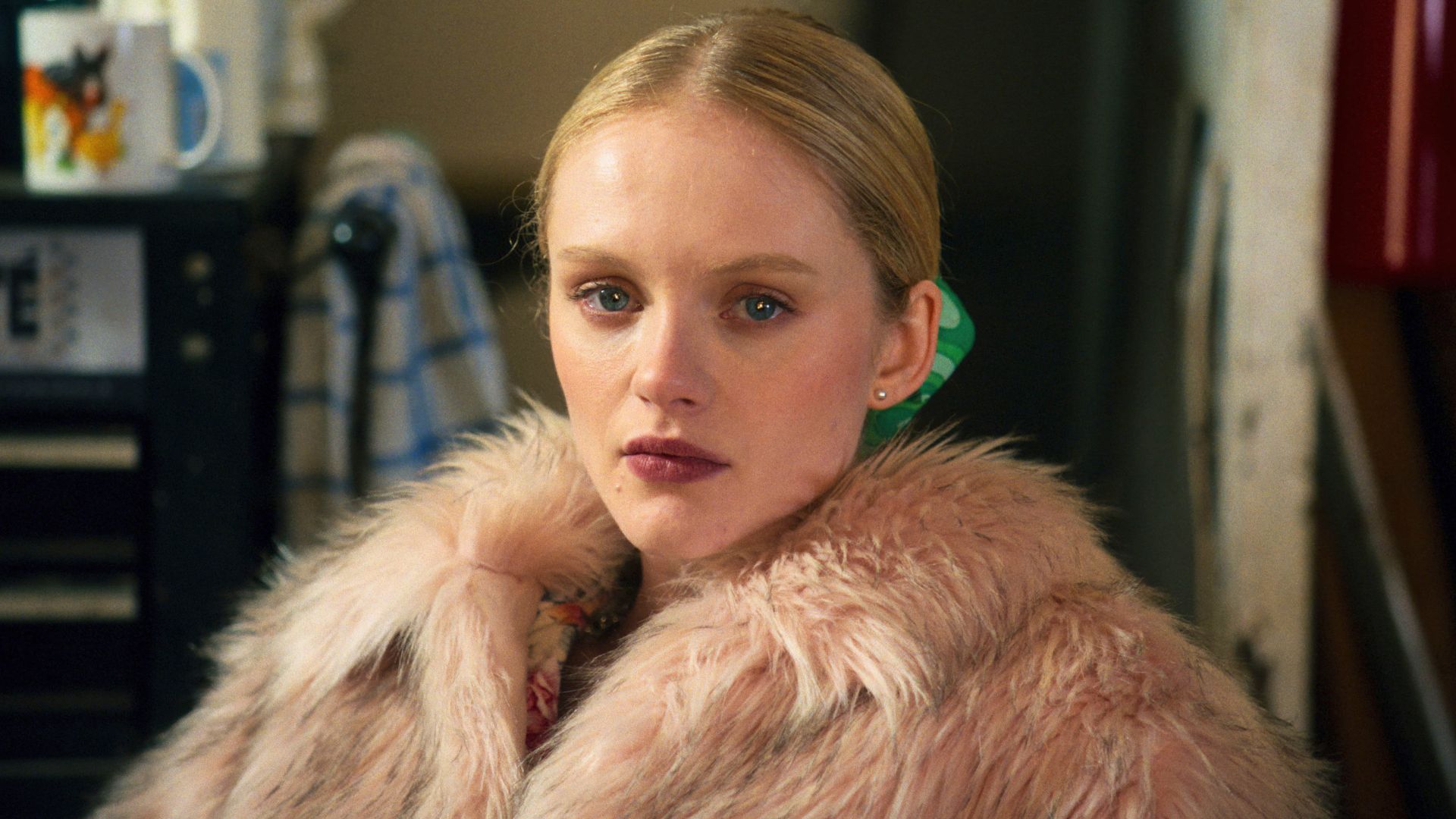 Emma Laird stares at something off camera