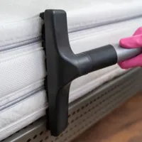 What builds up on a mattress that isn't cleaned