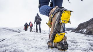 Hikers crossing icy terrain in crampons