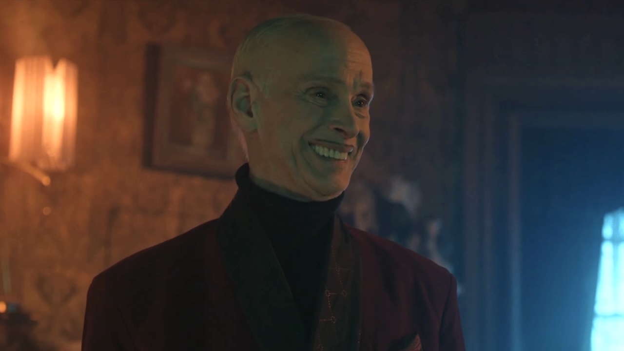 John Waters smiling as Wendell Wilkins in Chucky Season 3