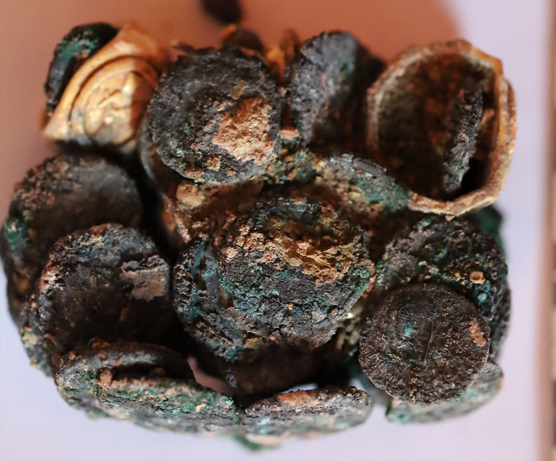 a clump of burnt and charred coins