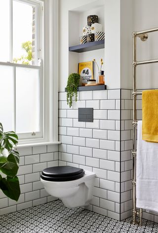 Ali and Neil Gunn gave a dated 1970s bathroom in their south east London home a monochrome makeover