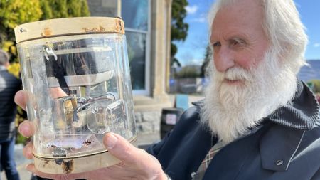 Researchers found a 1970 camera trap originally set up to research the Loch Ness legend. This image depicts the camera before restoration, held by researcher Adrian Shine