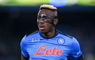 Napoli striker Victor Osimhen, wearing a protective face mask